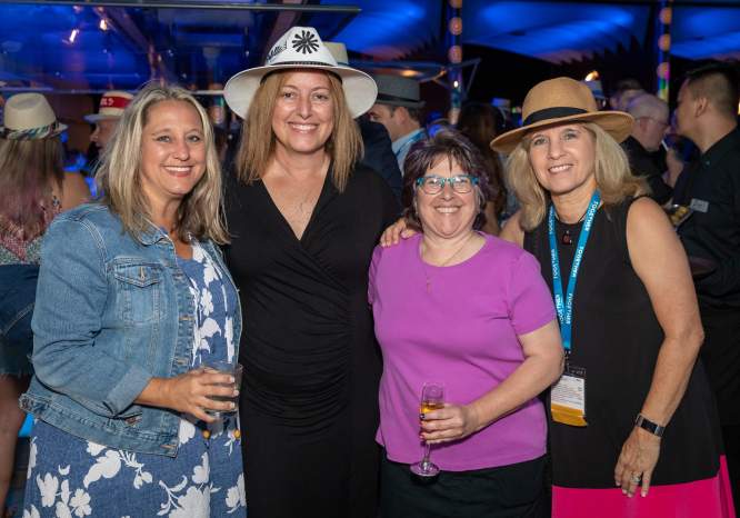 Four women attending an evening party