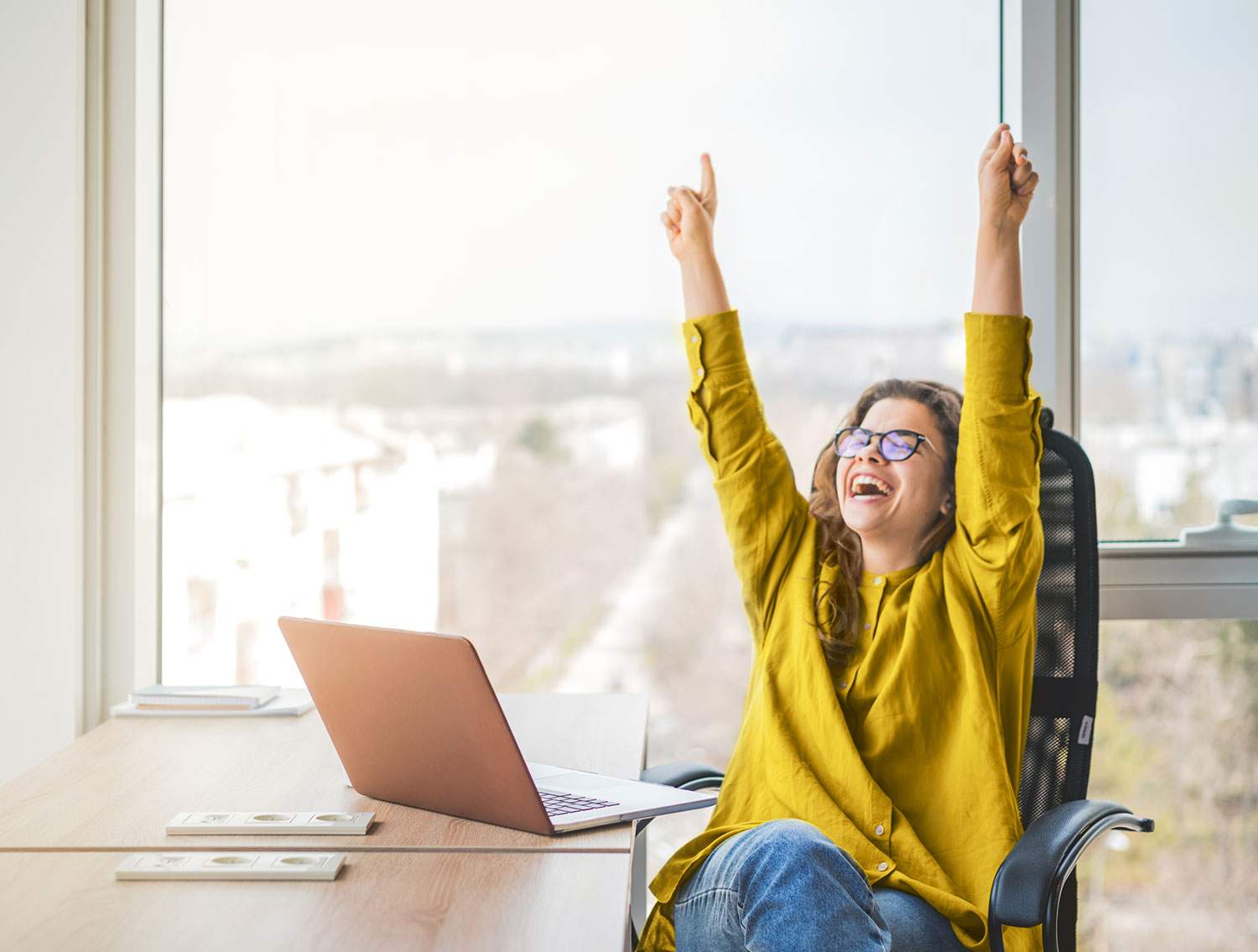 Woman having fun at her computer - what are some fun part time jobs?