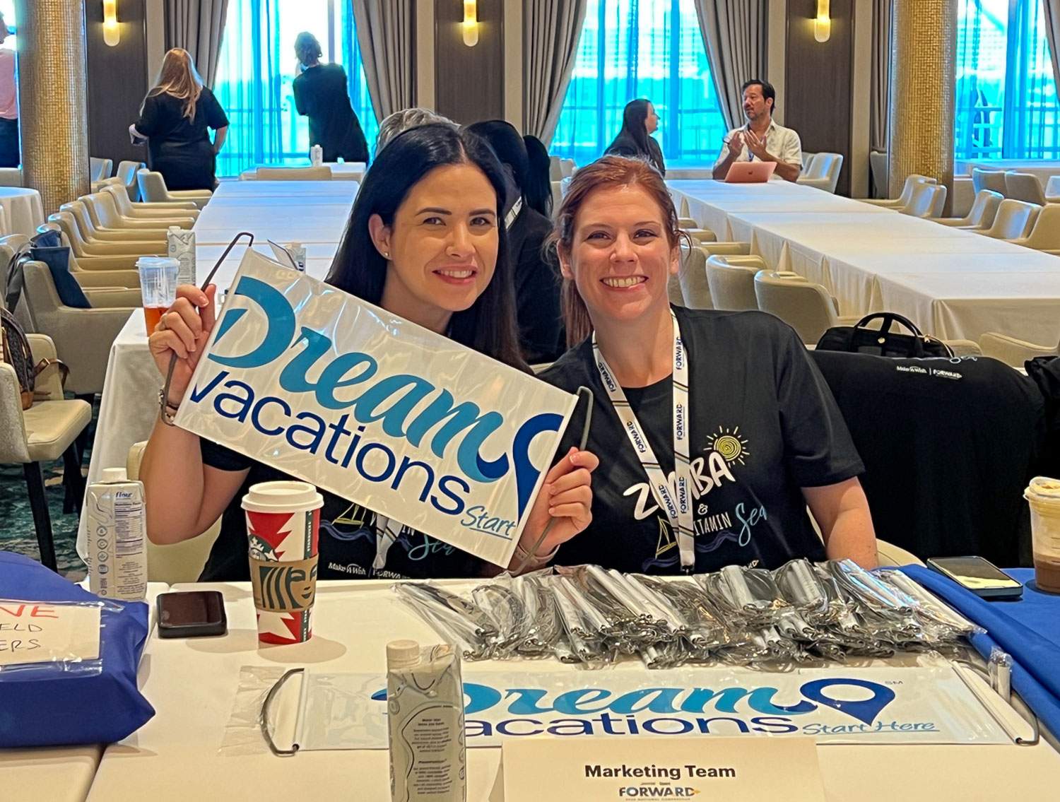 two women at a dream vacations conference table - what do travel advisors do