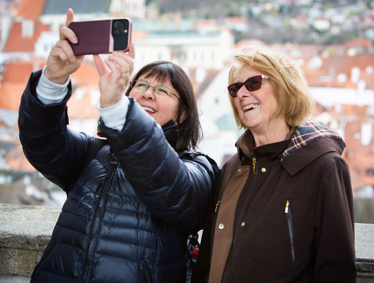 two women taking a selfie - travel agent fam trips 2023