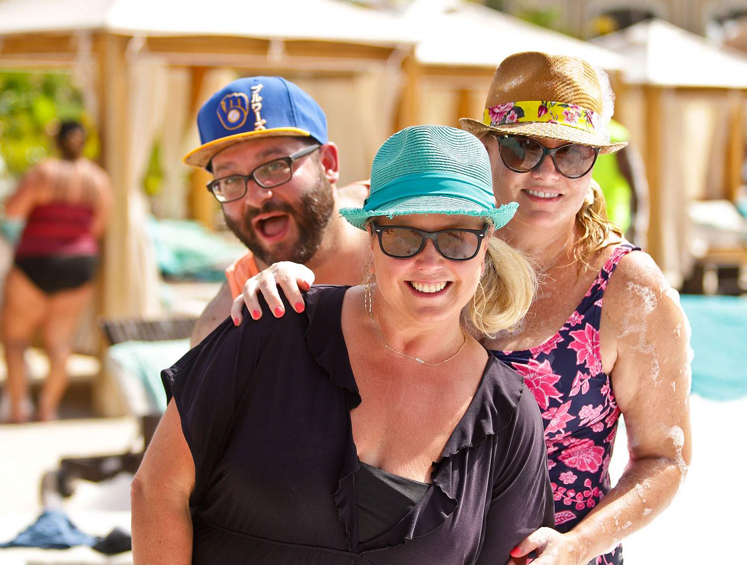 Three Instagram travel influencers at the pool deck