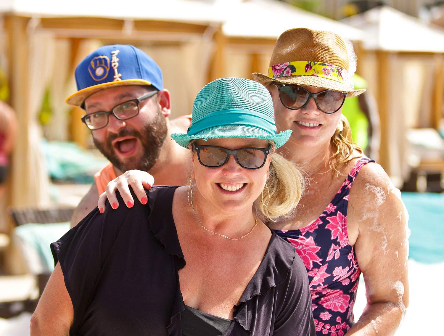 three travel agents by the pool