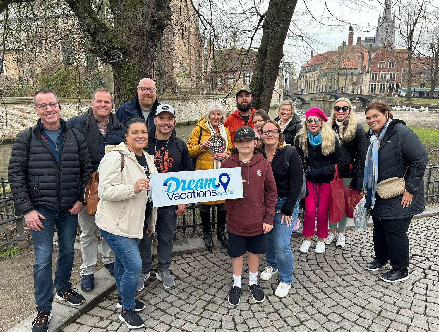 group of advisors holding a Dream Vacations sign
