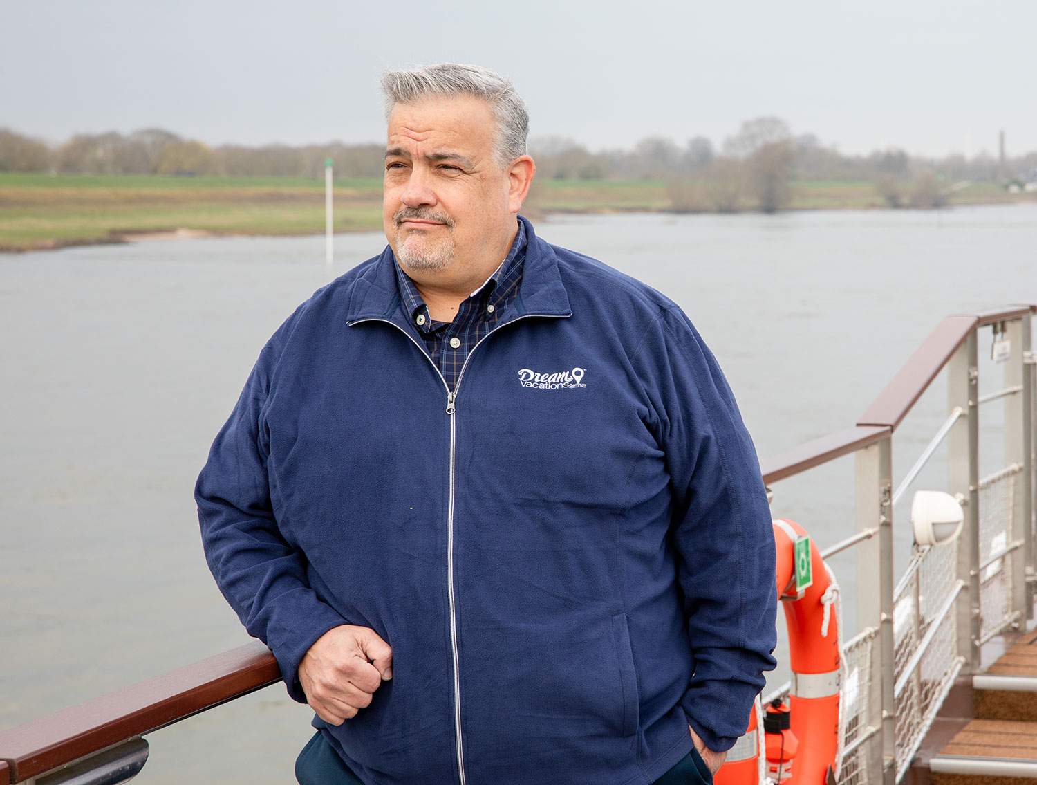 man on a boat balcony